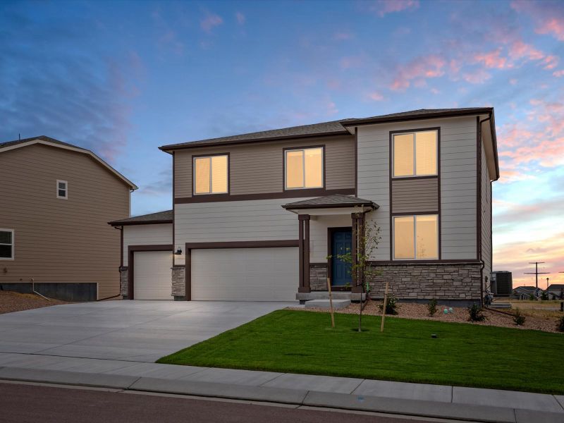 Front exterior of a new home in Paint Brush Hills, Peyton, CO, highlighting curb appeal (Image 1). Front exterior of a new home in Paint Brush Hills, Peyton, CO, highlighting curb appeal (Image 1).
