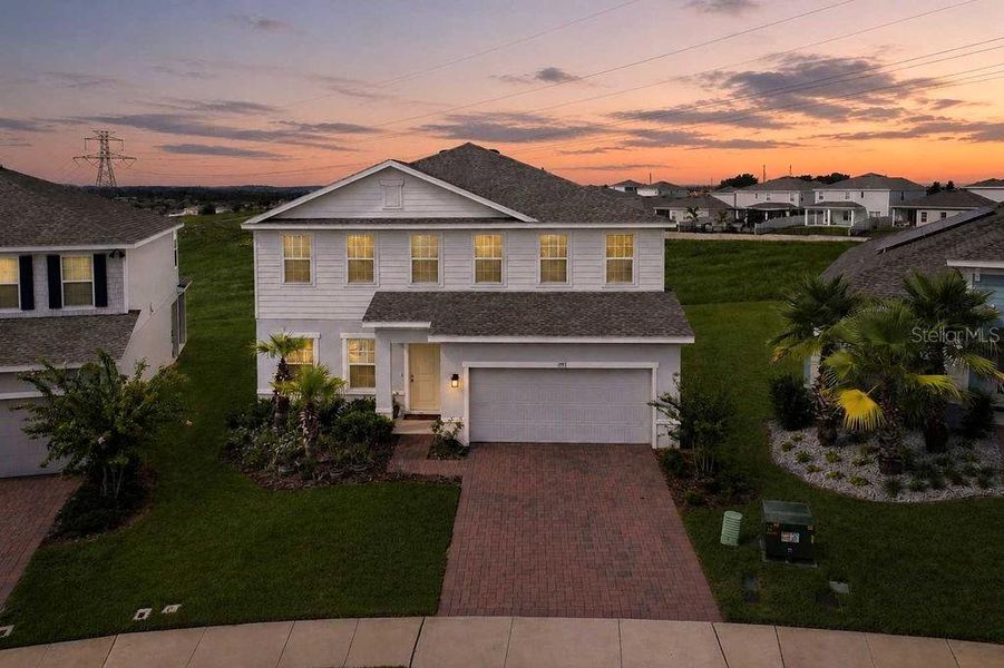 Front exterior of a new home in , Minneola, FL, highlighting curb appeal (Image 26). Front exterior of a new home in , Minneola, FL, highlighting curb appeal (Image 26).