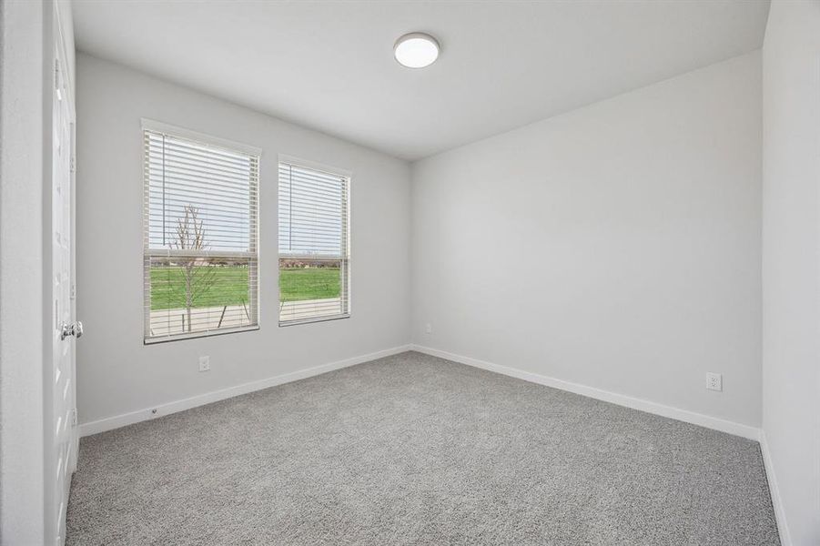 Bedroom in the Masters home plan by Trophy Signature Homes – REPRESENTATIVE PHOTO