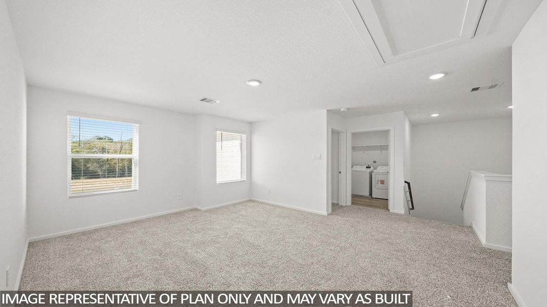 A spacious and inviting loft area provides versatile living space with abundant natural illumination.