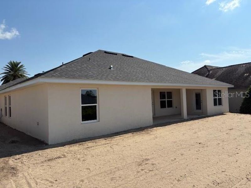 Front exterior of a new home in Juliette Falls, Dunnellon, FL, highlighting curb appeal (Image 2).