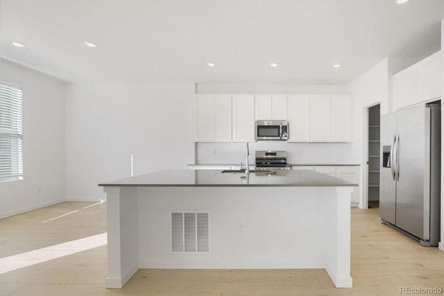 Furnished interior view inside a new home in Parterre, Thornton (Image 4).