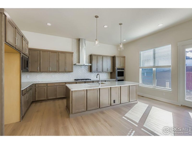 Furnished interior view inside a new home in RainDance, Windsor (Image 6).