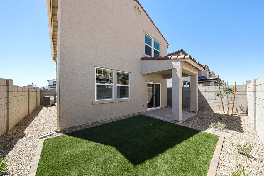 A house with a green lawn.