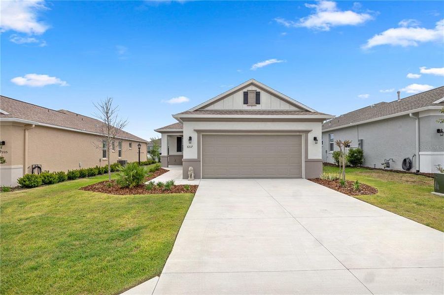 Front exterior of a new home in , Ocala, FL, highlighting curb appeal (Image 23).