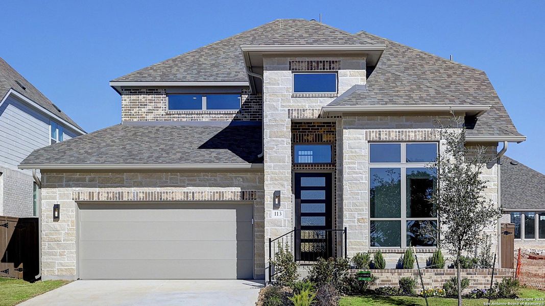 Front exterior of a new home in Corley Farms 50', Boerne, TX, highlighting curb appeal (Image 2).