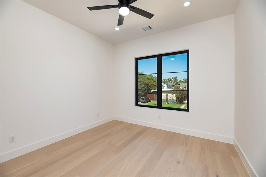 Spare room featuring light wood-type flooring, recessed lighting, and a ceiling fan Spare room featuring light wood-type flooring, recessed lighting, and a ceiling fan