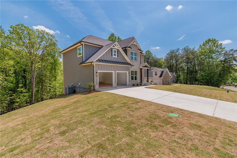 Front exterior of a new home in , Gainesville, GA, highlighting curb appeal (Image 20). Front exterior of a new home in , Gainesville, GA, highlighting curb appeal (Image 20).