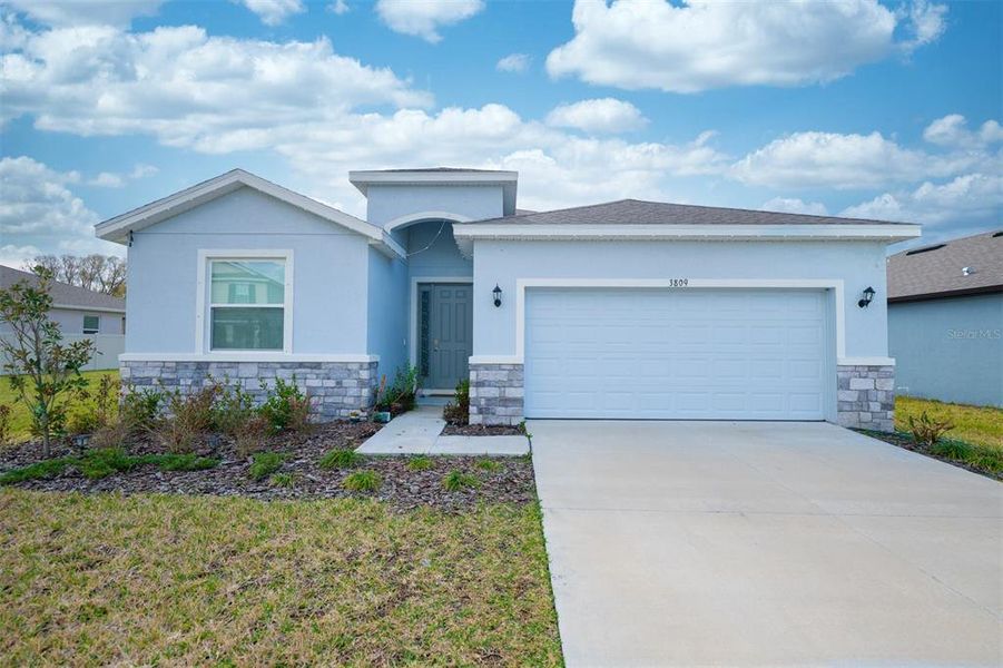 Front exterior of a new home in North Park Isle, Plant City, FL, highlighting curb appeal (Image 24).