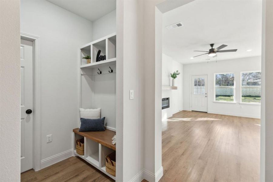 Mudroom with light wood-type flooring and ceiling fan