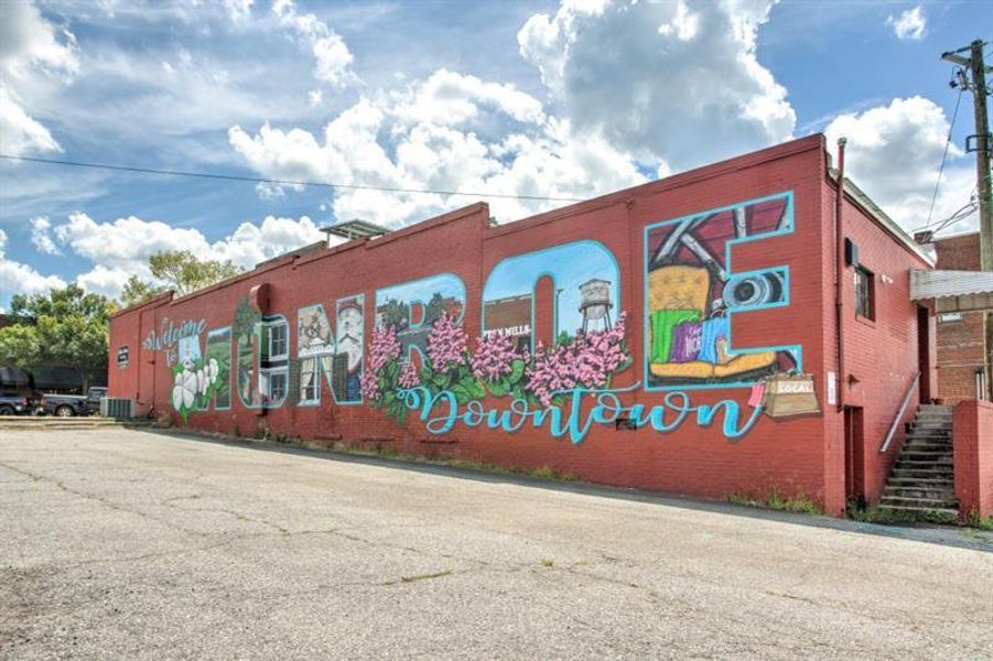 Front exterior of a new home in Pinegate, Covington, GA, highlighting curb appeal (Image 24).