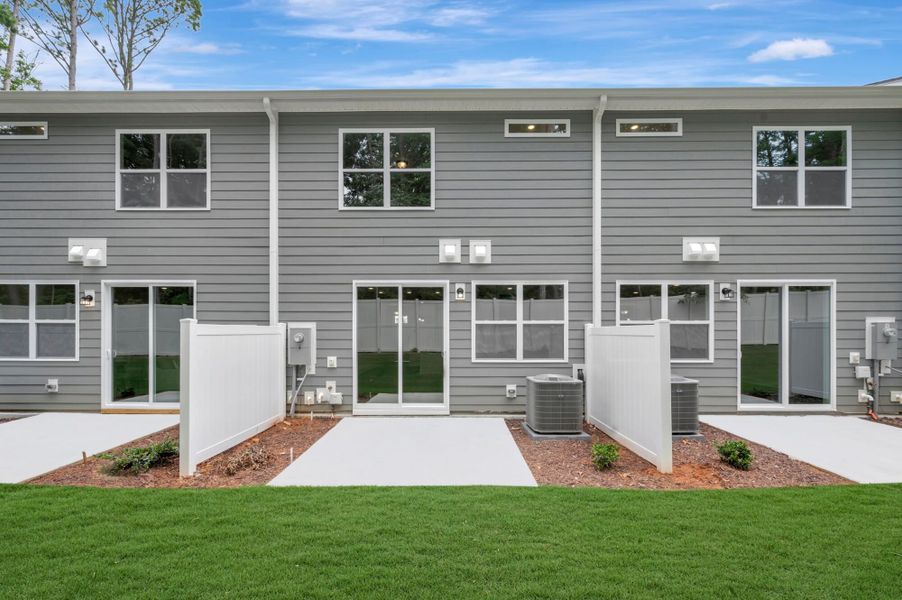 Exterior details and patio area of a home in Ashmore Townes, Garner (Image 3). Exterior details and patio area of a home in Ashmore Townes, Garner (Image 3).
