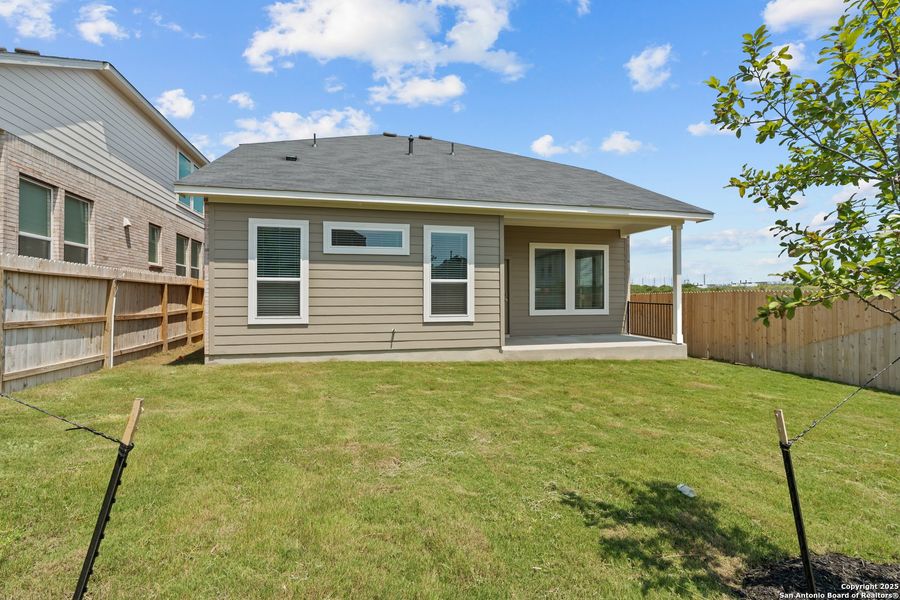 Front exterior of a new home in Hunters Ranch, San Antonio, TX, highlighting curb appeal (Image 25). Front exterior of a new home in Hunters Ranch, San Antonio, TX, highlighting curb appeal (Image 25).