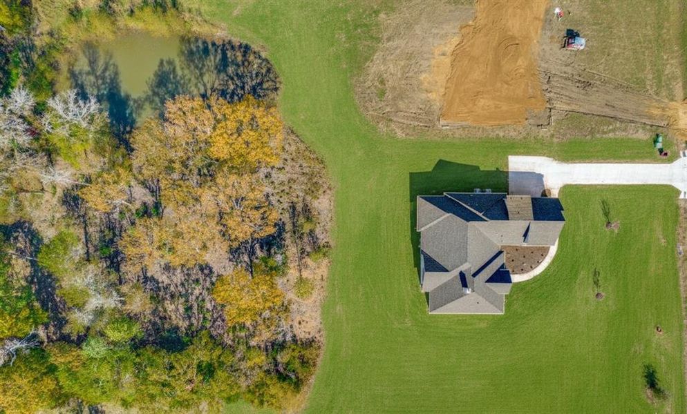 Aerial overview of property's location with a large body of water