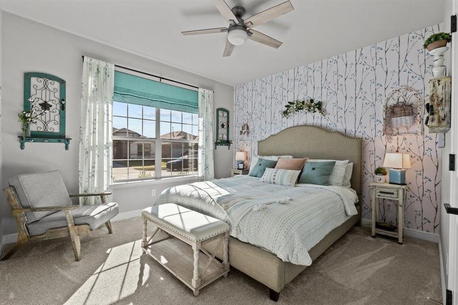 Bedroom featuring carpet and ceiling fan