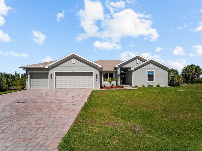 Front exterior of a new home in Port Charlotte, Port Charlotte, FL, highlighting curb appeal (Image 30).