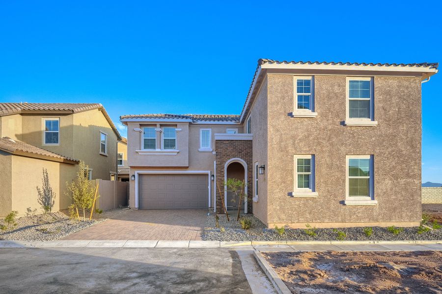 Front exterior of a new home in Blossom Rock, Apache Junction, AZ, highlighting curb appeal (Image 1). Front exterior of a new home in Blossom Rock, Apache Junction, AZ, highlighting curb appeal (Image 1).