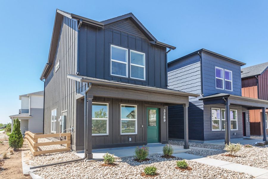 Front exterior of a new home in Bloom, Fort Collins, CO, highlighting curb appeal (Image 30). Front exterior of a new home in Bloom, Fort Collins, CO, highlighting curb appeal (Image 30).