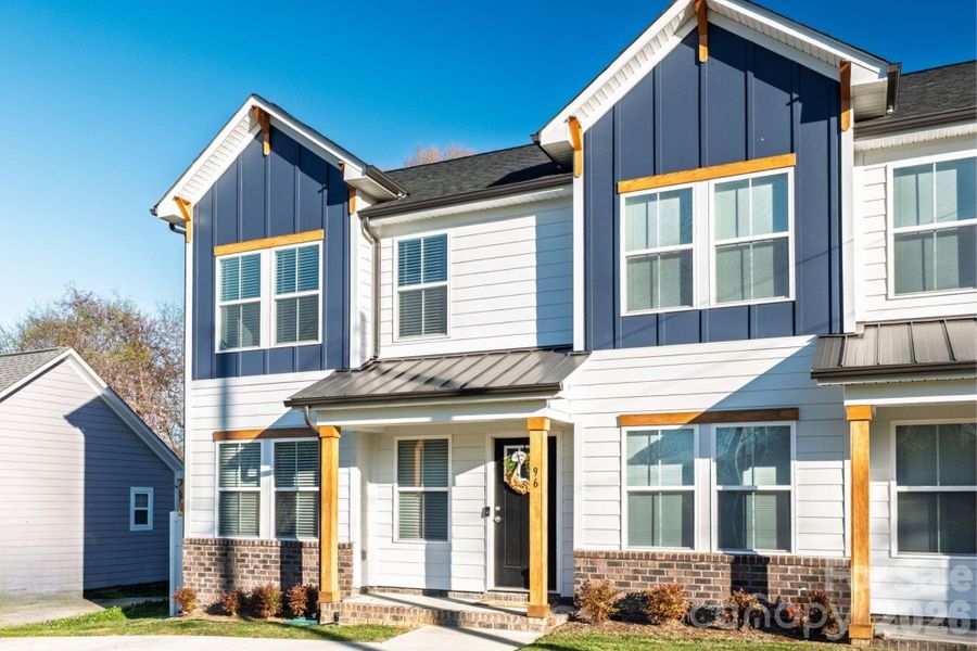 Front exterior of a new home in , Concord, NC, highlighting curb appeal (Image 16).