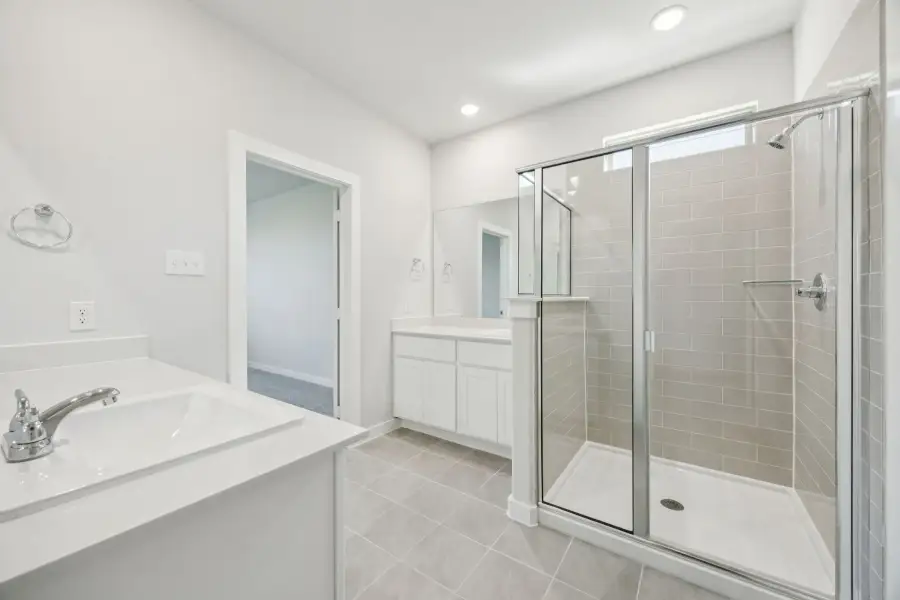 Primary Bathroom in the Masters home plan by Trophy Signature Homes – REPRESENTATIVE PHOTO Primary Bathroom in the Masters home plan by Trophy Signature Homes – REPRESENTATIVE PHOTO