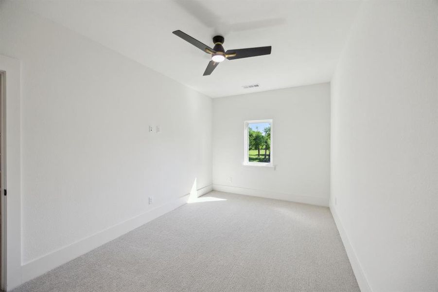 Upstairs bedroom with baseboards, a ceiling fan, and visible vents Upstairs bedroom with baseboards, a ceiling fan, and visible vents