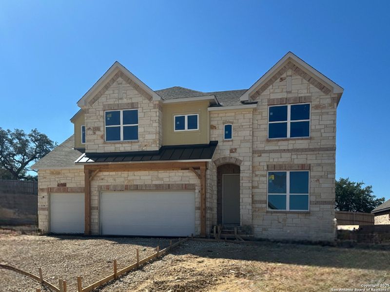 Front exterior of a new home in Sunday Creek at Kinder Ranch, San Antonio, TX, highlighting curb appeal (Image 13). Front exterior of a new home in Sunday Creek at Kinder Ranch, San Antonio, TX, highlighting curb appeal (Image 13).