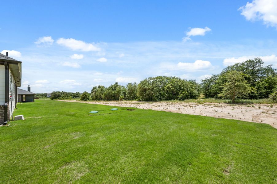 Front exterior of a new home in Saddleback Estates, Boyd, TX, highlighting curb appeal (Image 22).