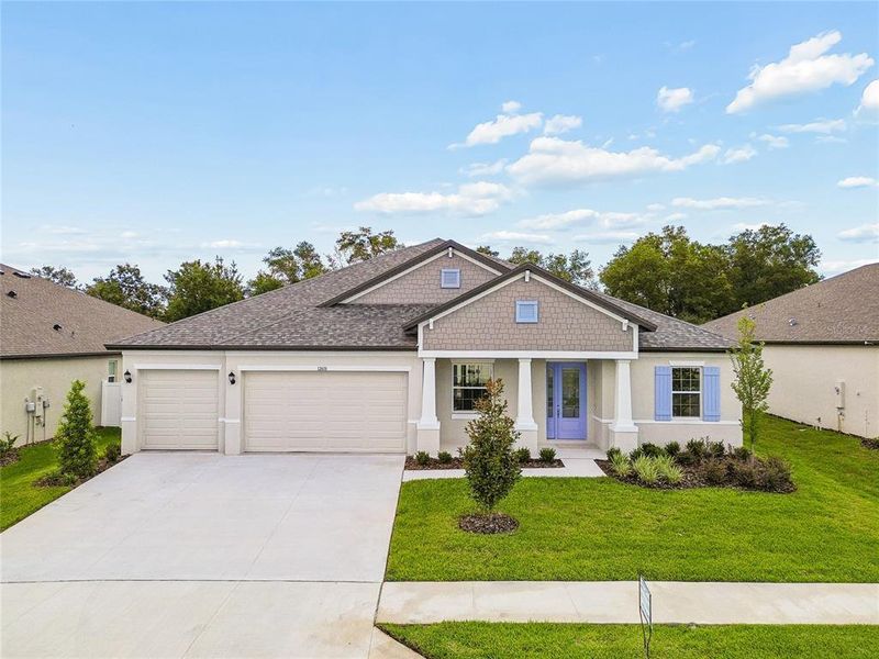 Front exterior of a new home in Pinecone Reserve, Brooksville, FL, highlighting curb appeal (Image 2). Front exterior of a new home in Pinecone Reserve, Brooksville, FL, highlighting curb appeal (Image 2).