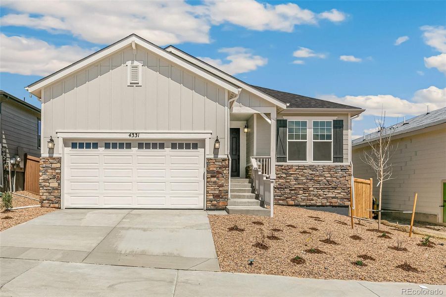 Front exterior of a new home in Terrain Oak Valley, Castle Rock, CO, highlighting curb appeal (Image 1). Front exterior of a new home in Terrain Oak Valley, Castle Rock, CO, highlighting curb appeal (Image 1).