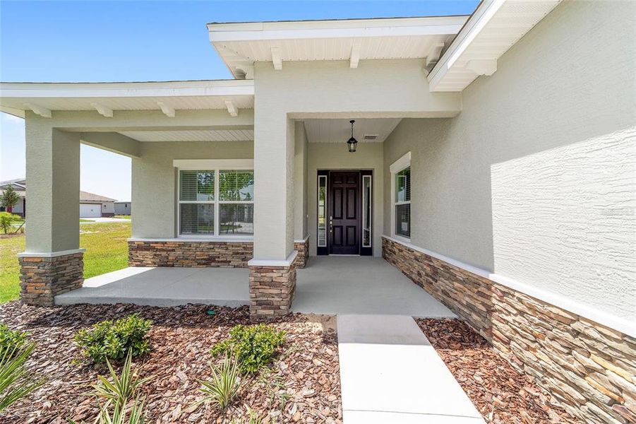 Front exterior of a new home in On Top of the World Communities, Ocala, FL, highlighting curb appeal (Image 23).