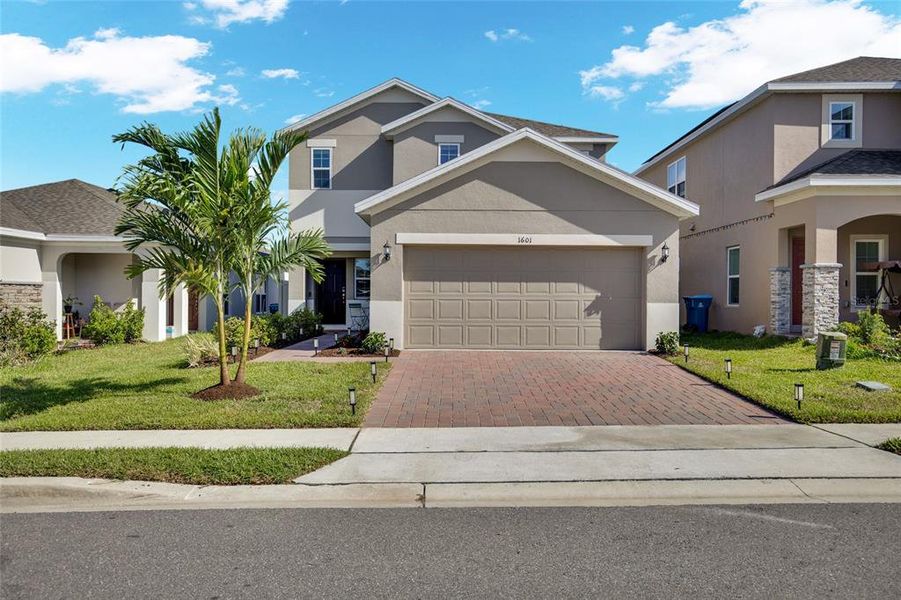 Front exterior of a new home in Horse Creek at Crosswinds, Davenport, FL, highlighting curb appeal (Image 29). Front exterior of a new home in Horse Creek at Crosswinds, Davenport, FL, highlighting curb appeal (Image 29).