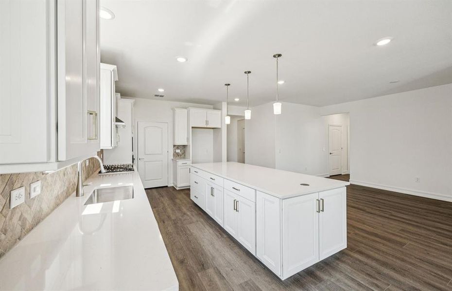High-end gourmet kitchen with premium finishes and upgraded appliances *Real home pictured High-end gourmet kitchen with premium finishes and upgraded appliances *Real home pictured