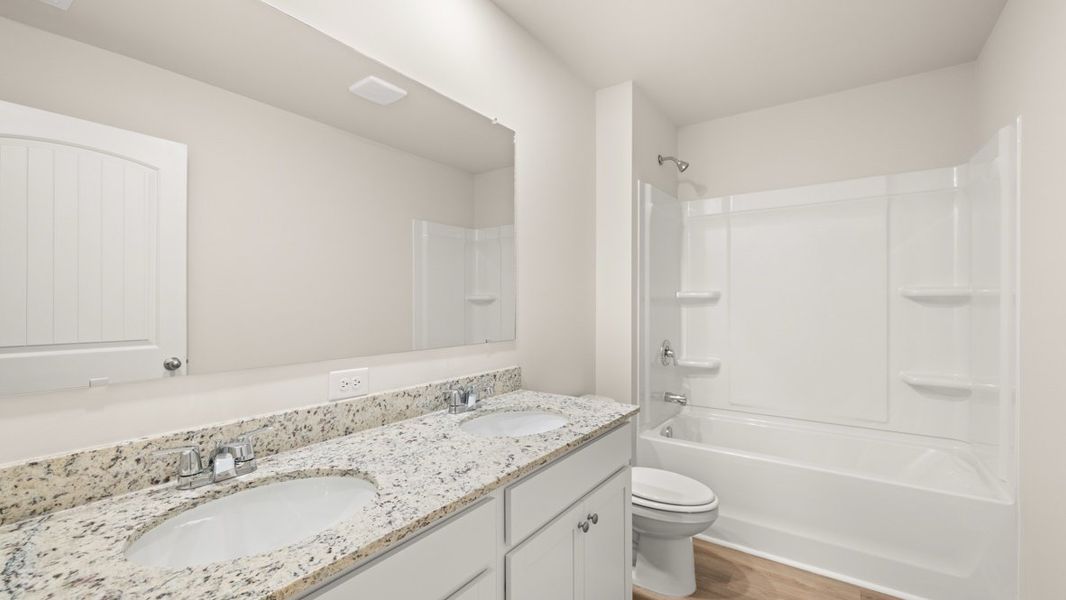 Representative furnished interior of a home built from the Flora by D.R. Horton in Sheffield Highlands, Dallas (Image 12).