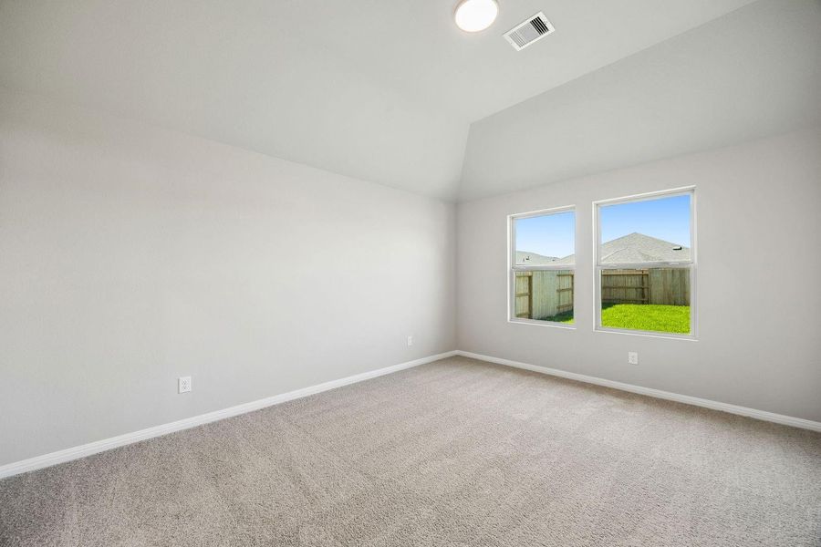 Primary Bedroom in the Sabine home plan by Trophy Signature Homes – REPRESENTATIVE PHOTO