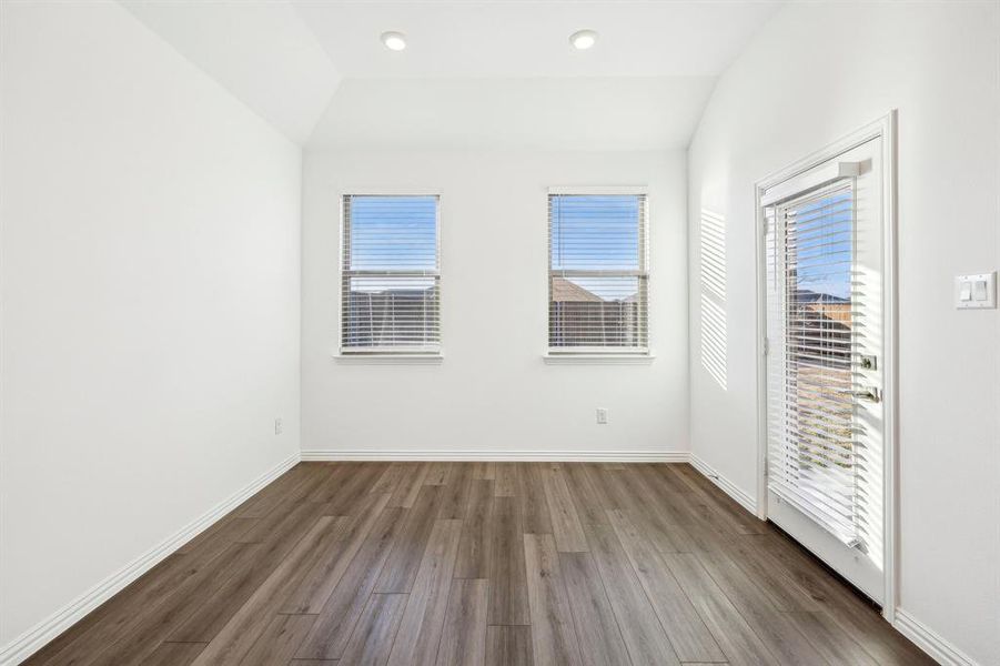 eat in dining area hardwood / wood-style floors