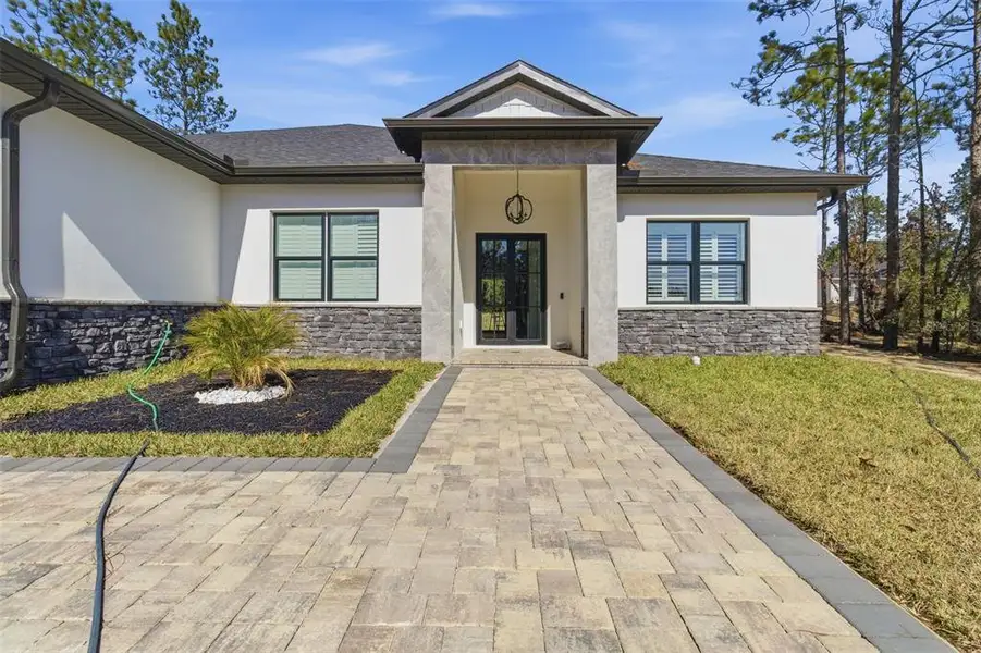 Front exterior of a new home in , Dunnellon, FL, highlighting curb appeal (Image 2). Front exterior of a new home in , Dunnellon, FL, highlighting curb appeal (Image 2).