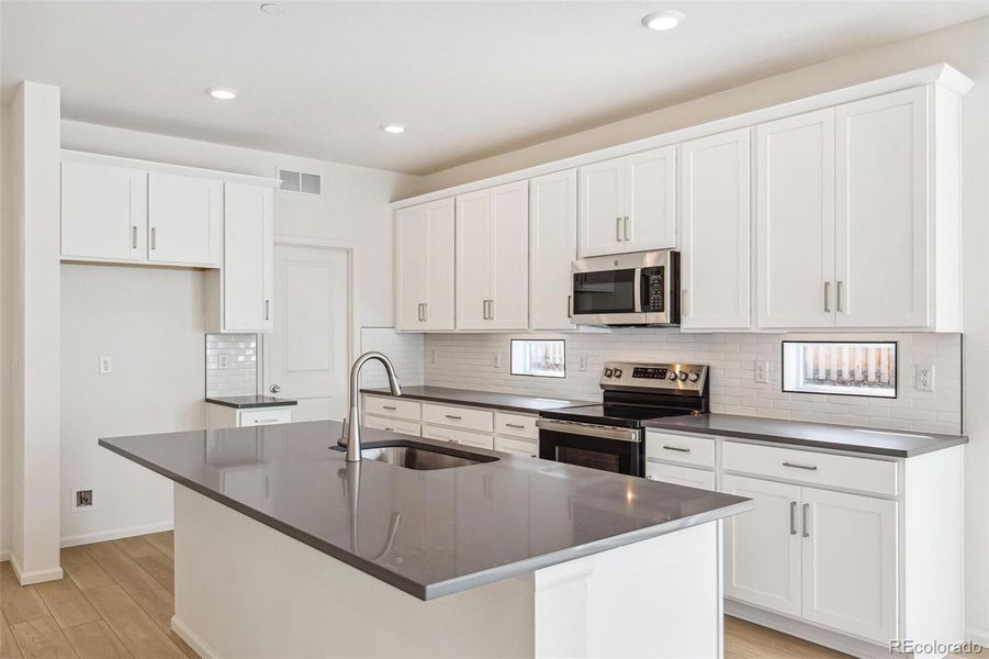 Furnished interior view inside a new home in Turnberry, Commerce City (Image 13).