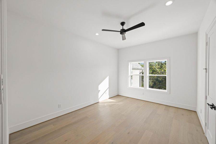 One of three secondary, private guest suites upstairs, all with walk-in closets!