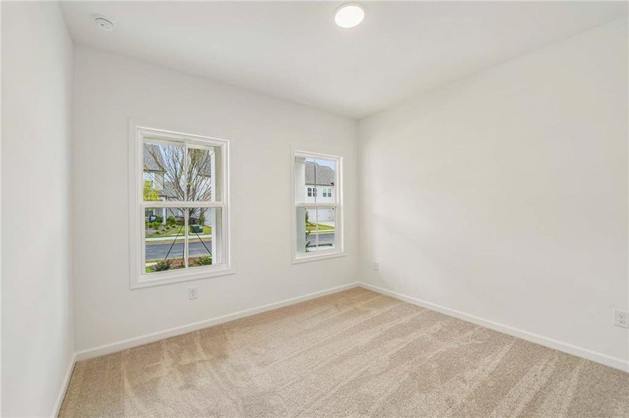 Spacious, unfurnished interior of a new home in Eastlyn Crossing, Flowery Branch (Image 22).