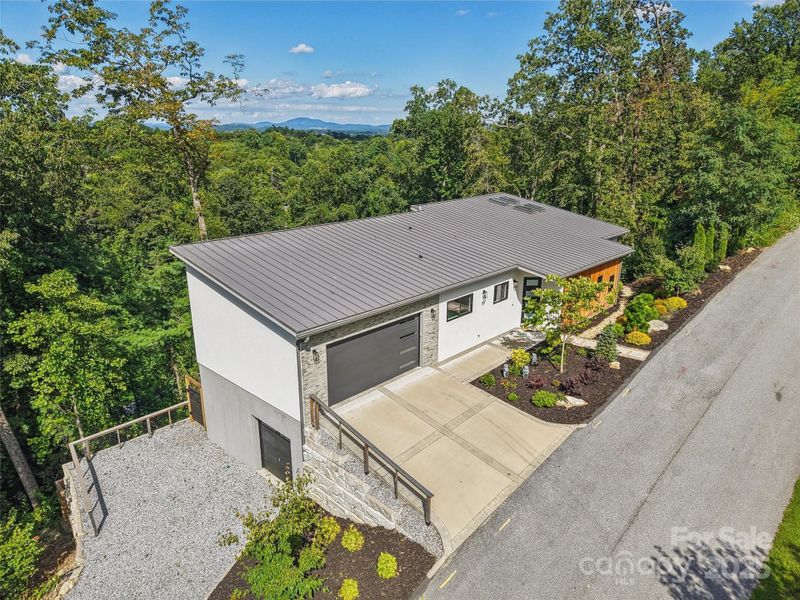 Front exterior of a new home in , Hendersonville, NC, highlighting curb appeal (Image 19).