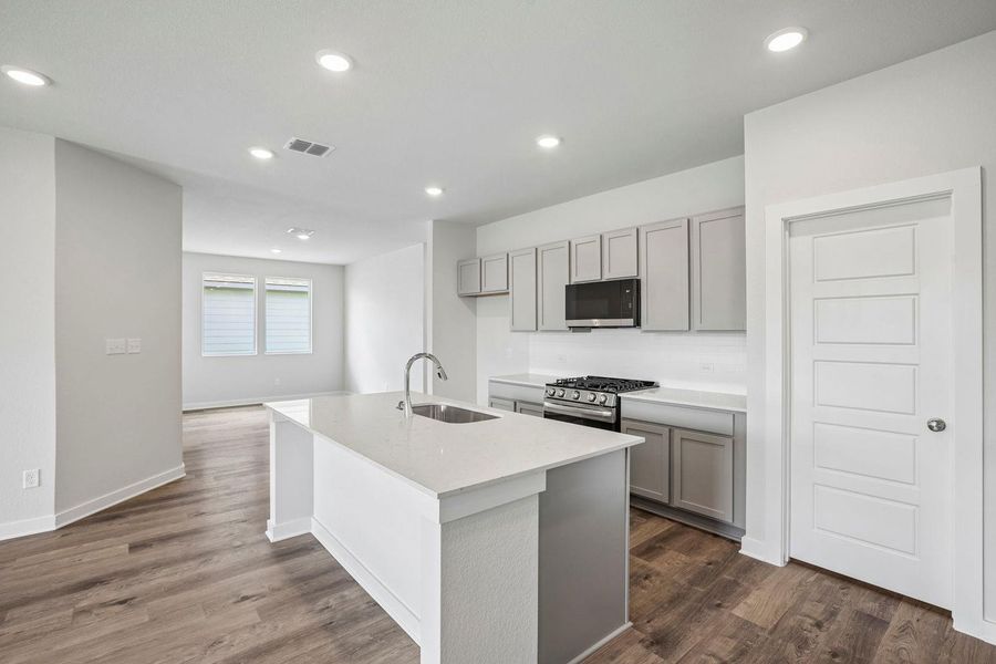 Furnished interior view inside a new home in Stallion Run, Buda (Image 6).