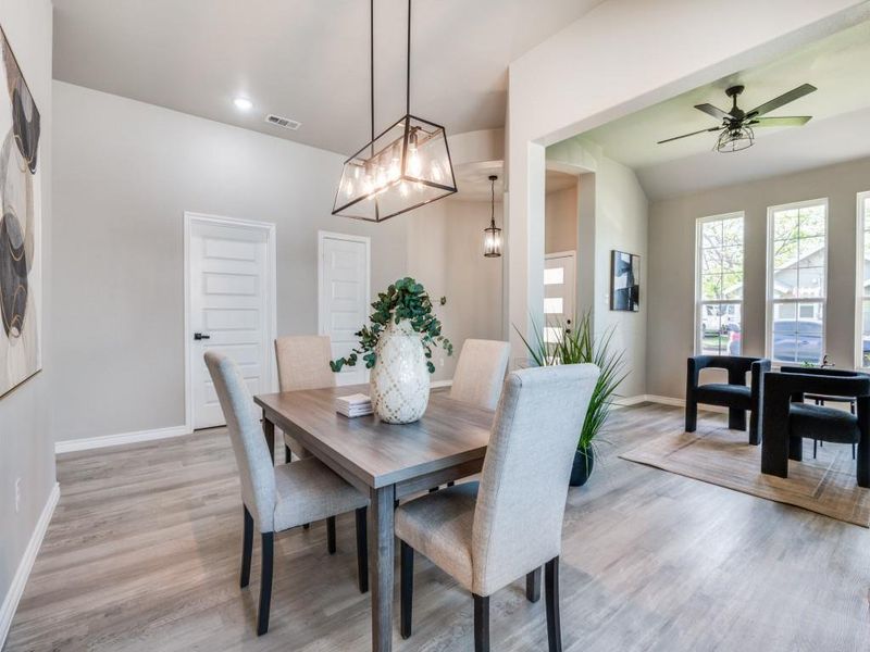 Dining room featuring baseboards, recessed lighting, light wood-style floors, visible vents, and ceiling fan Dining room featuring baseboards, recessed lighting, light wood-style floors, visible vents, and ceiling fan