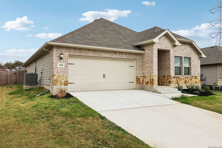 Front exterior of a new home in Legendary Trails - Classic Series, Cibolo, TX, highlighting curb appeal (Image 28).