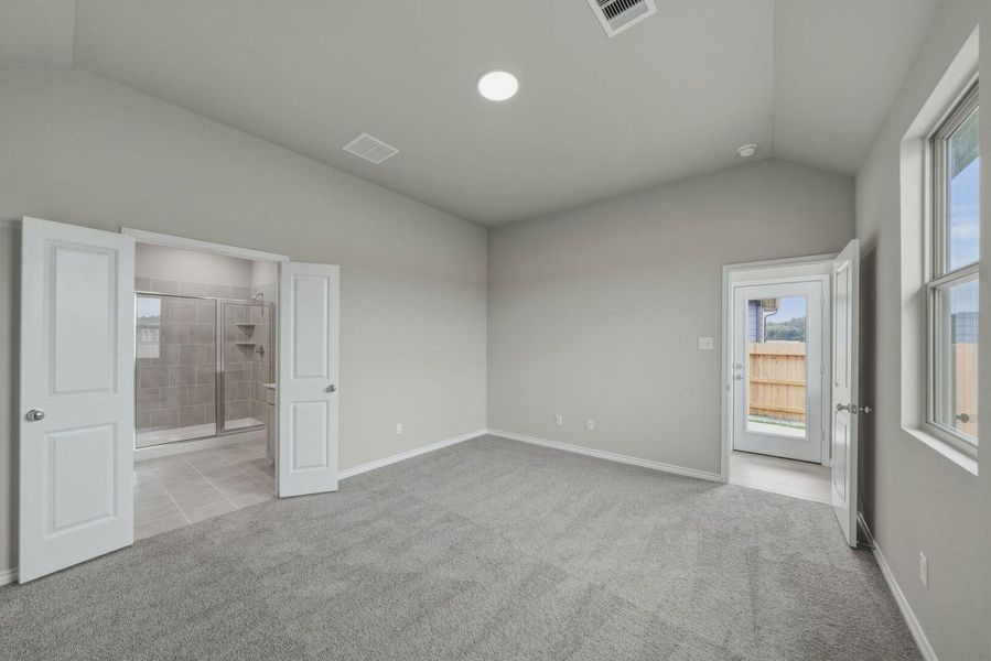 Primary Bedroom in the Cedar home plan by Trophy Signature Homes – REPRESENTATIVE PHOTO