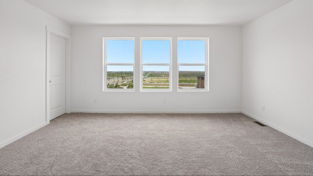 Primary bedroom with natural light and spacious layout. Primary bedroom with natural light and spacious layout.