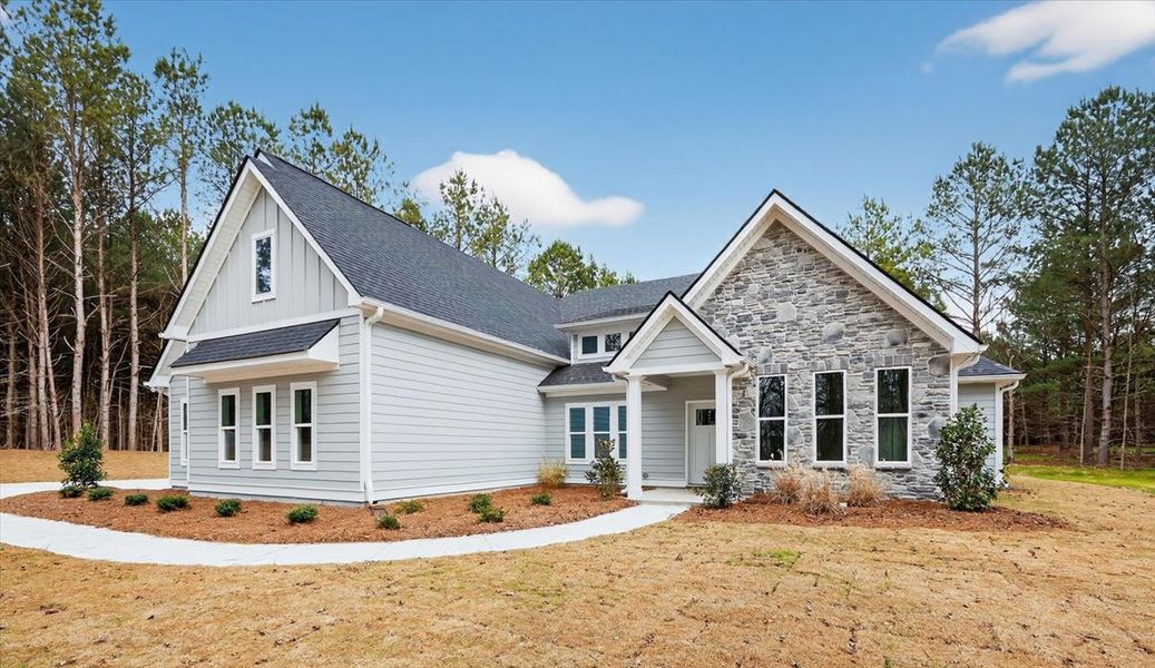Front exterior of a new home in White Oaks, The Rock, GA, highlighting curb appeal (Image 23). Front exterior of a new home in White Oaks, The Rock, GA, highlighting curb appeal (Image 23).