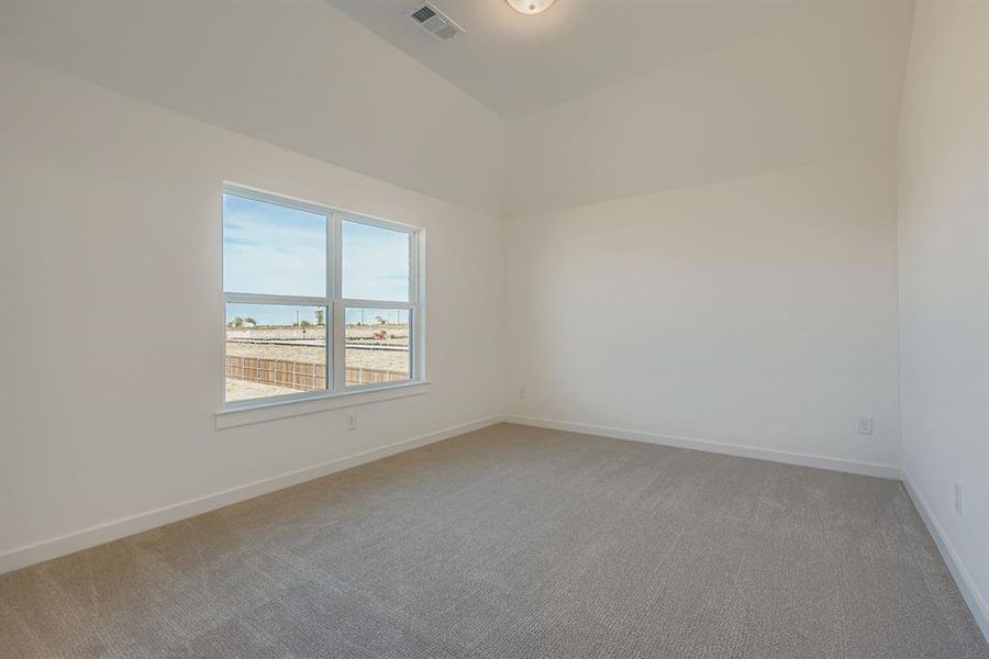 Unfurnished room featuring light carpet and a water view Unfurnished room featuring light carpet and a water view