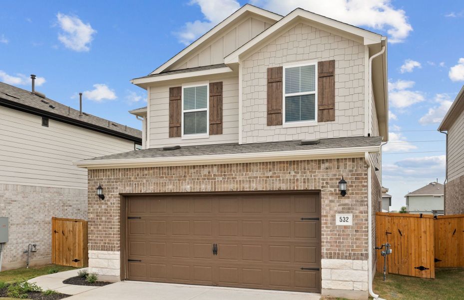 Front exterior of a new home in Crosswinds, Kyle, TX, highlighting curb appeal (Image 6).