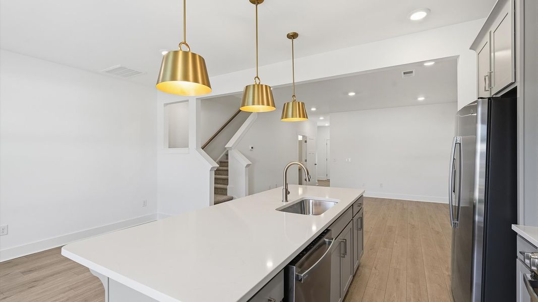 Luxury-inspired kitchen featuring expansive prep space and elegant design elements at Saluda Crossing