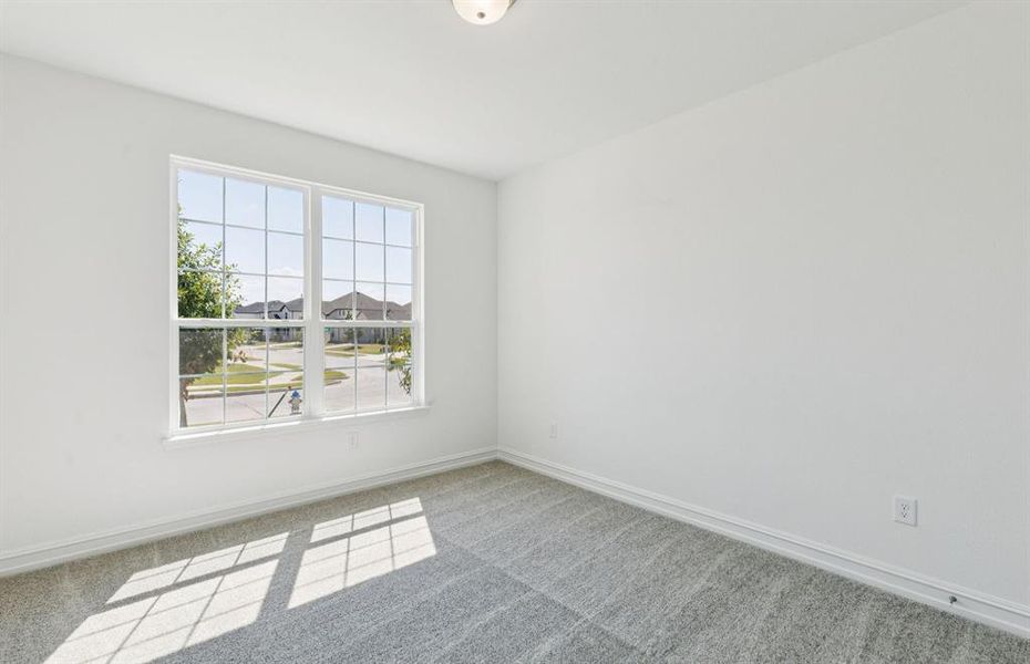 Spacious secondary bedroom with large windows Spacious secondary bedroom with large windows